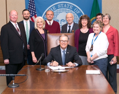 The Governor signing the bill.